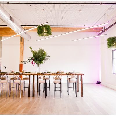 The grassaliere chandelier is a custom creation by LightSmiths that allows you to wrap a drum light with real or faux greenery and florals.